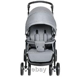 Poussette double pliable avec siège avant et arrière pour bébé en bas âge, couleur grise.